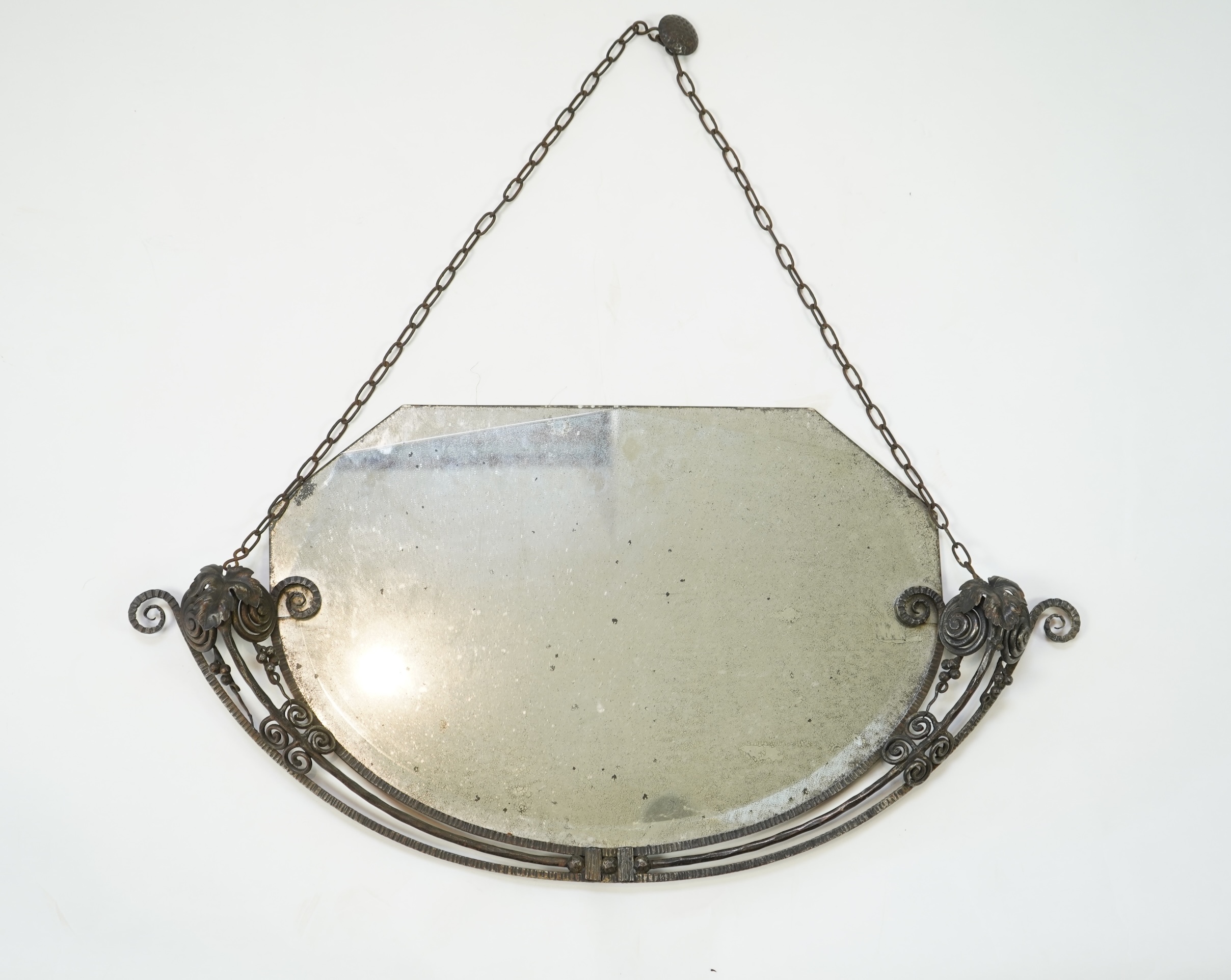 Manner of Edgar Brandt (French, 1880-1960): An Art Deco style wall mirror
